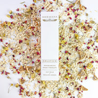 scattered salt flowers and oats, tall white box, Shemana logo, solstice