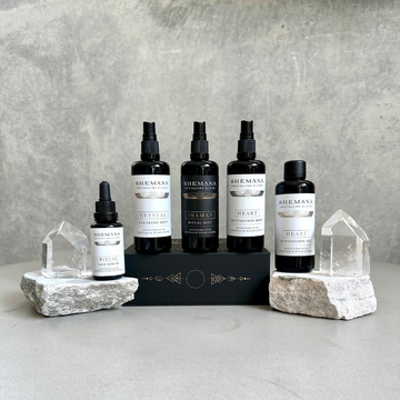 Shemana Mists, Heart oil and face serum group photo with stones and clear quartz crystal