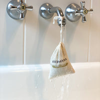 white bathroom, small cotton bag for soaks, Shemana logo