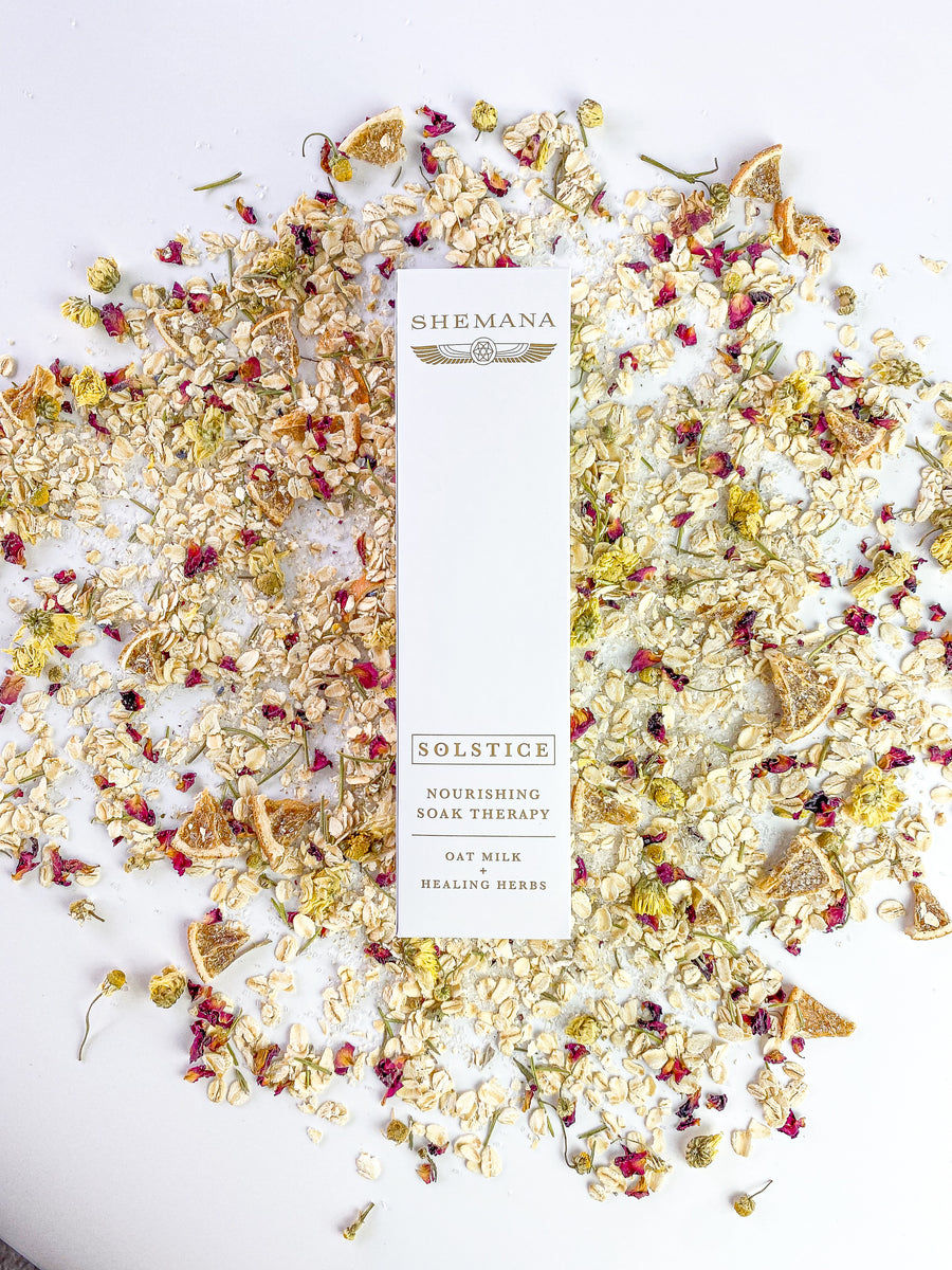 scattered salt flowers and oats, tall white box, Shemana logo, solstice