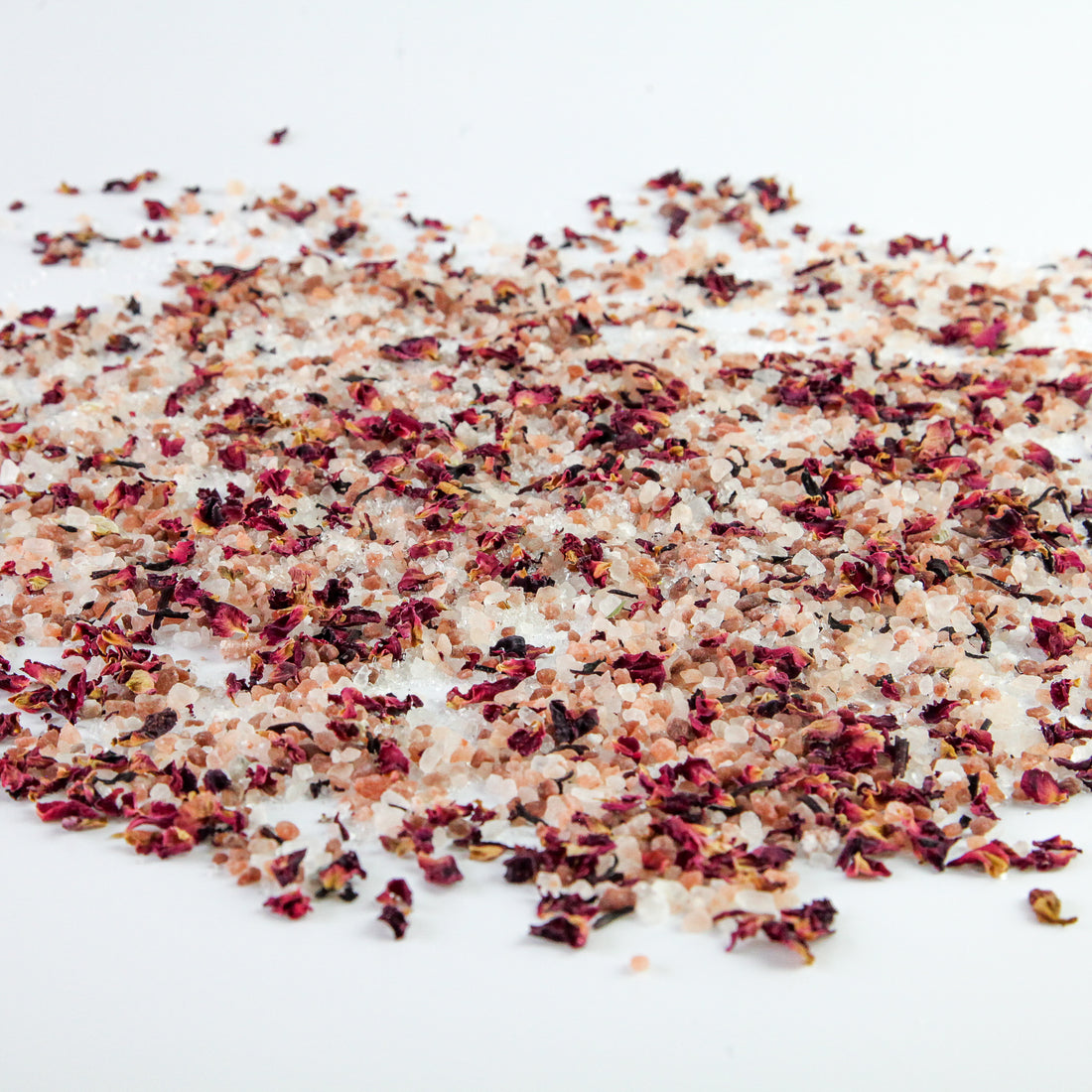 pink salt scattered, wild flowers, bath soak, white background